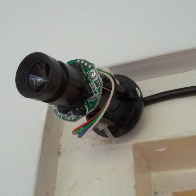 Webcam, stripped and attached to wall.